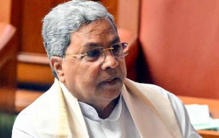 Siddaramaiah’s Shoes Untied by Congress Worker with Tricolour: Video