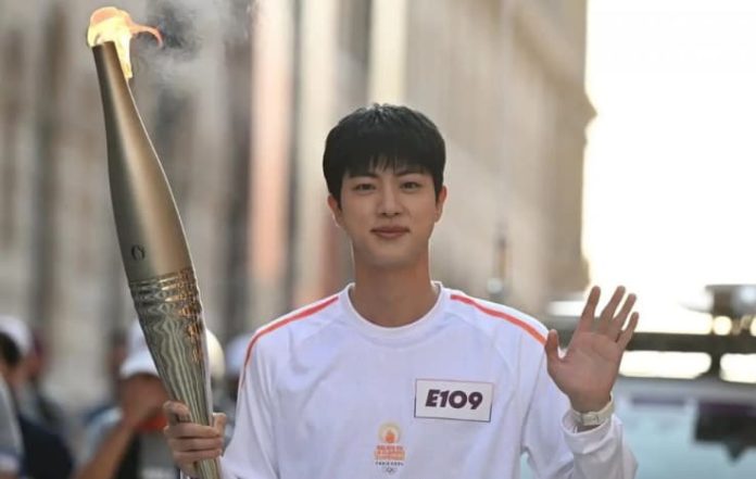 BTS' Jin Carries Olympic Flame in Paris